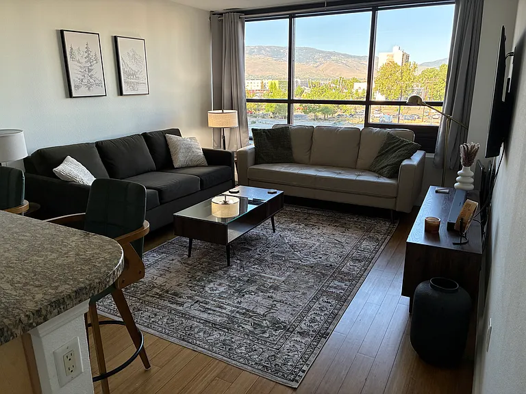 Living room. Two comfy couches. Big screen TV. Beautiful picture window views.
