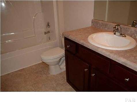 GUEST BATH. LAMINATE COUNTERTOPS AND CABINETS ARE TYPICAL OF THOSE USED IN OUR HOMES. PHOTOS OF THIS HOME TO BE ADDED WHEN AVAILABLE.