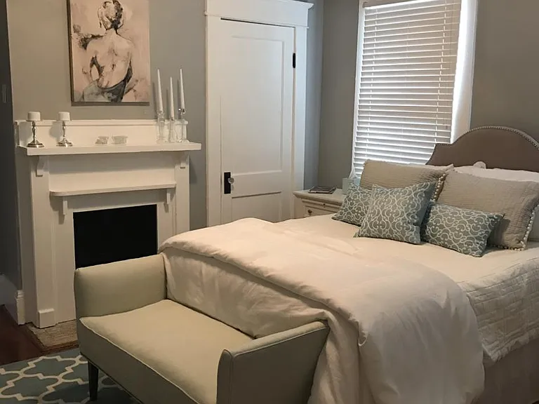 Second bedroom with en suite bathroom and functioning gas log fireplace