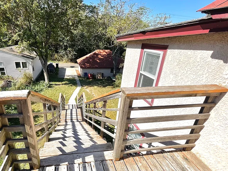 Stairs to garage and yard.