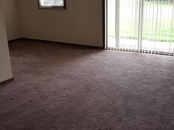 Large light living area with sliding glass door