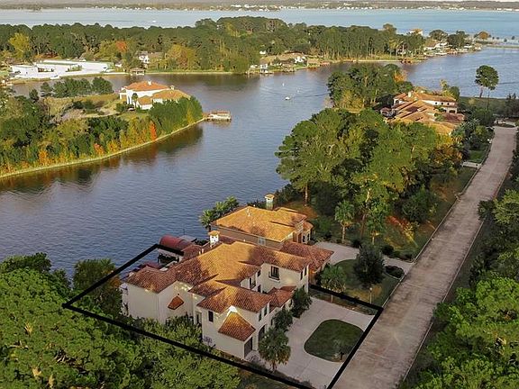 This home offers incredible water views and is seconds from your private dock to the open water of the lake.