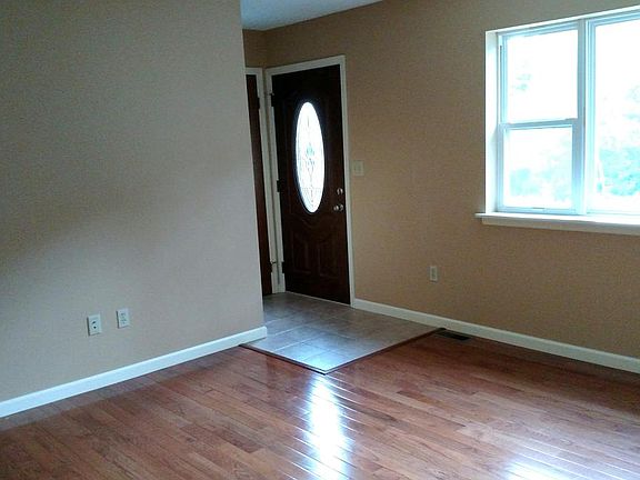 Living room has hardwood floors internet hookup. Thermostat