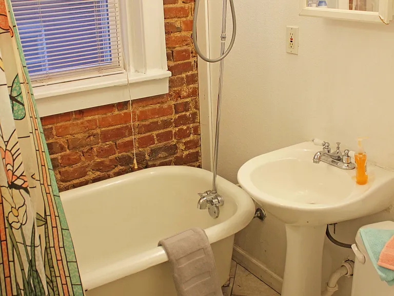 BATHROOM WITH ORIGINAL CLAWFOOT TUB
