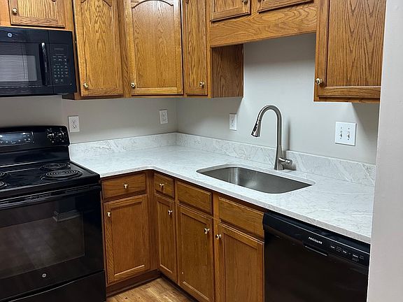 Kitchen with new counters, sink and dishwasher