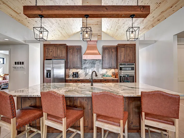The kitchen features top of the line appliances, all the cookware and gadgets you will need for your stay. Coffemaker, Airfryer, Toaster, Blender, Crock Pot and more. The large island is perfect or additional seating too.