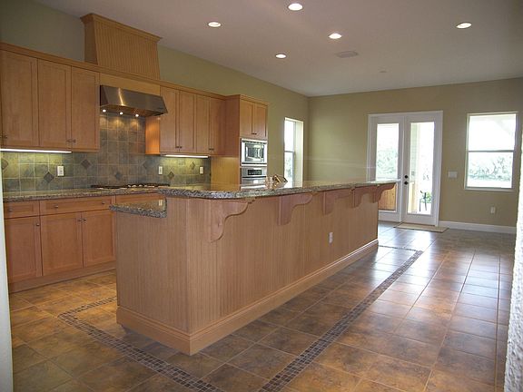 Open custom kitchen with eat in area