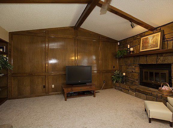 Exposed beam ceiling and built-in bookcase