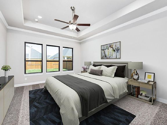 Luxurious primary bedroom suite