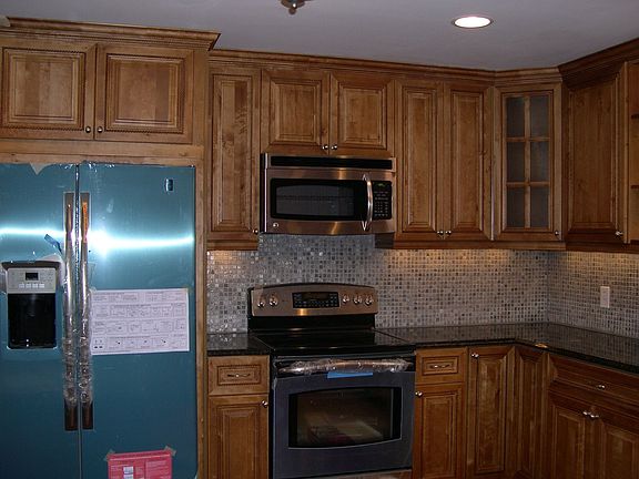 Renovated kitchen w/granite counters and GE Profile stainless appliances