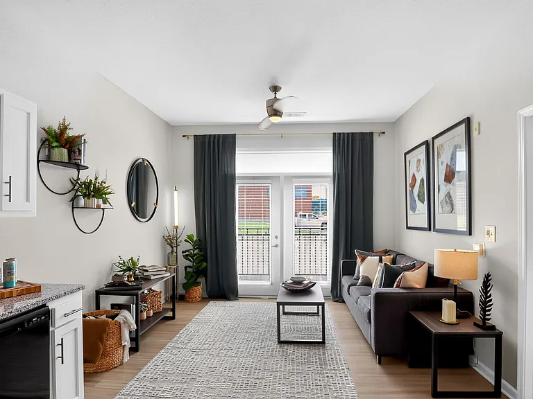 Open-Concept Living Room and Cozy Bedroom at Ralston Apartments in Downtown Indianapolis