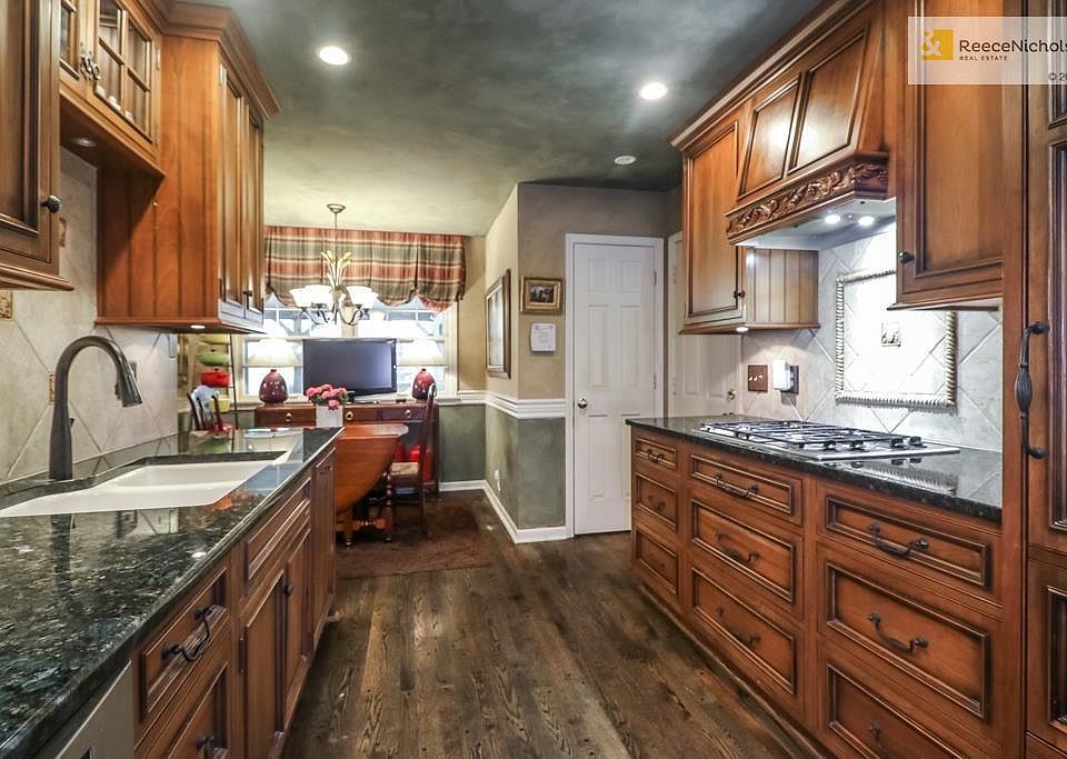 Custom kitchen cabinetry with built in Sub-zero refrigerator and high end appliances.