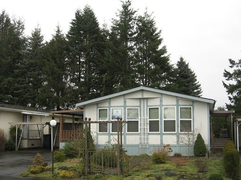 Double bay windows frame light and bright open floor plan.