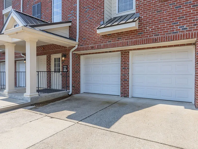 The garage door on the far right is for E-5 parking. The unit includes a huge 8x10 storage room in the Garage.