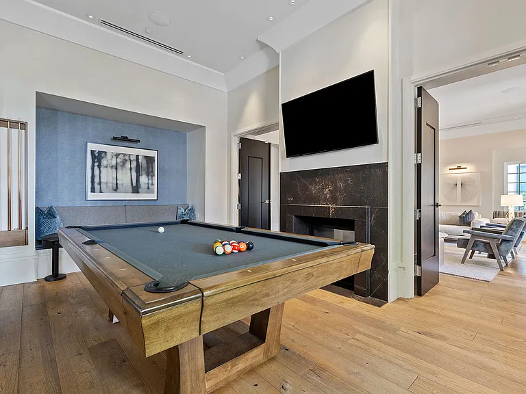 A stylish space for friendly competition and relaxed social time, this billiards lounge blends refined design with a laid-back atmosphere