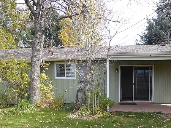 back side with a covered patio