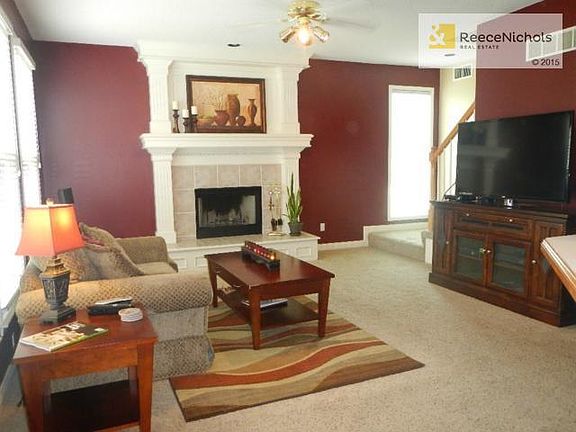 Spacious great room with fireplace - open to kitchen area.