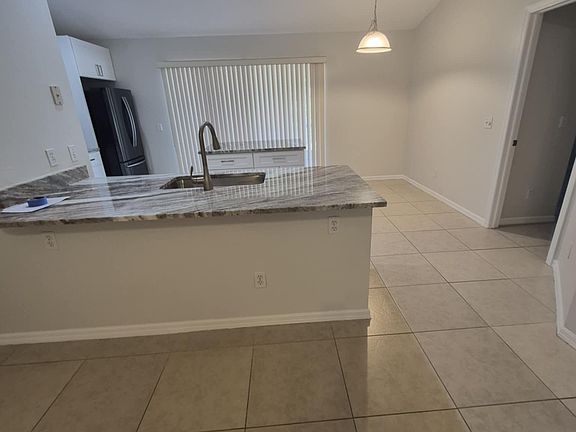 Kitchen with counter height breakfast bar