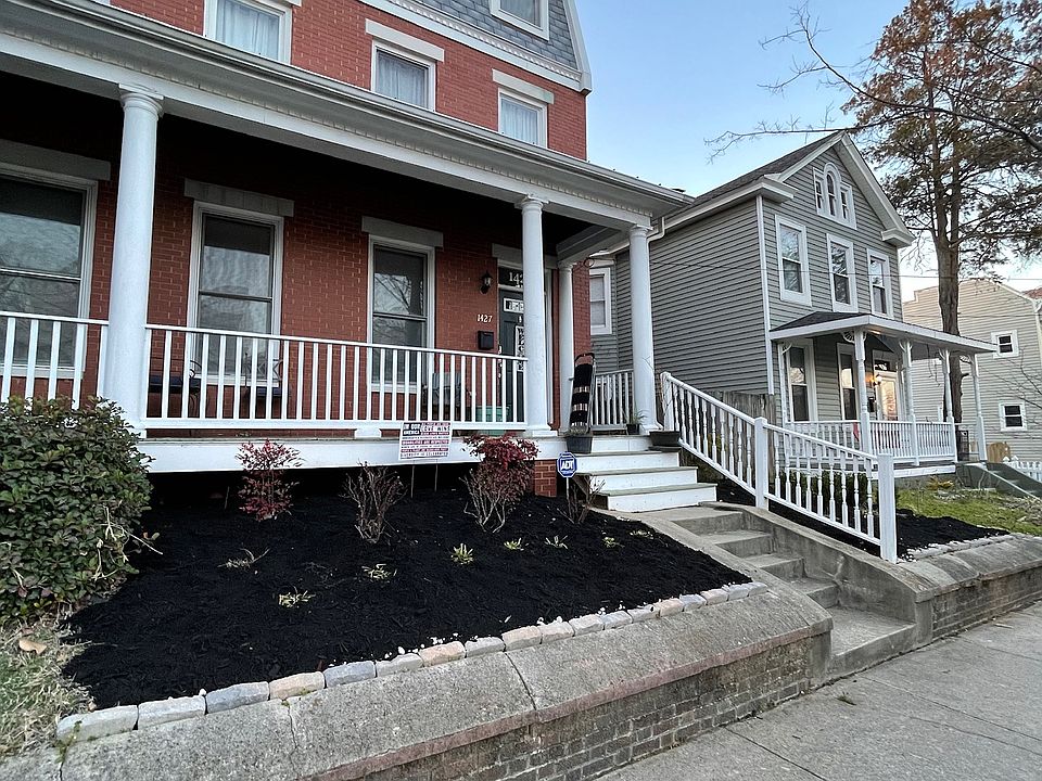 Front of house view with beautiful rose bushes that bloom twice yearly.