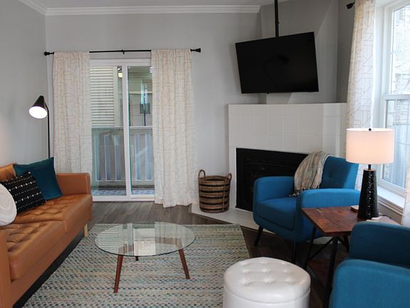 The sliding door in the living room leads to a balcony that connects to the primary bedroom