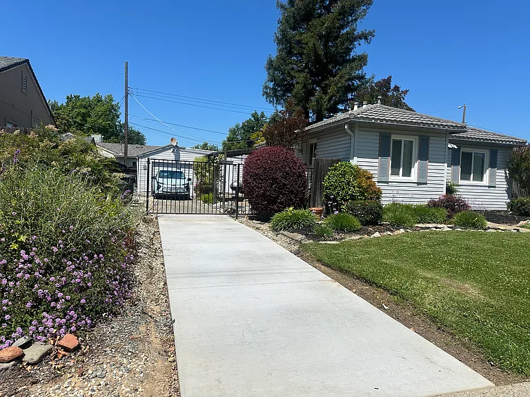 Gated, secured, off-street parking. Previous tenants charged their EV's behind the gate or in the garage.