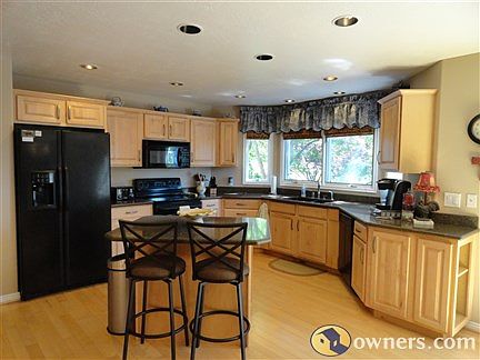 Updated kitchen with granite, island, pantry, hardwood floors.
