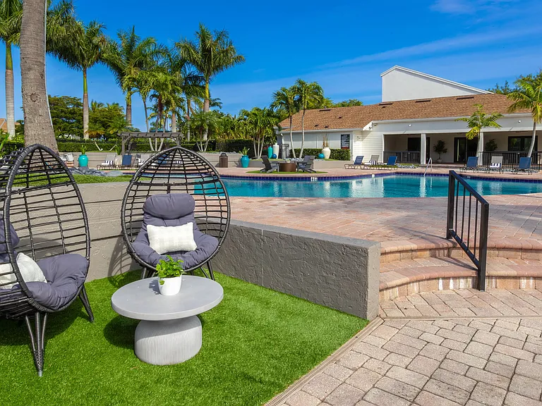 Discover captivating seating areas around propertyincluding this whimsical nook by the pool.