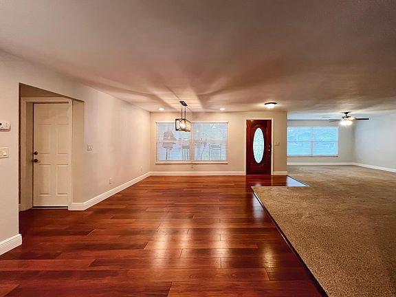Open Concept Entry with Living Room and Dining Room