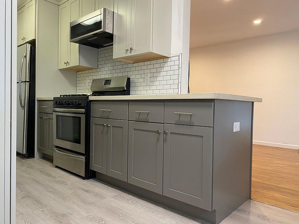 Kitchen has gas Stove with microwave hood vented out. Island has outlet for computer or blender.