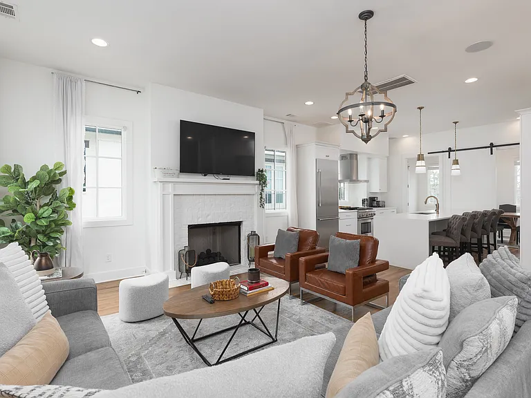 Cozy living room with comfortable seating, a fireplace and a Smart TV.