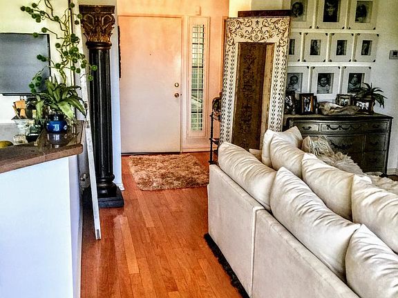 Living room looking into foyer/entryway
