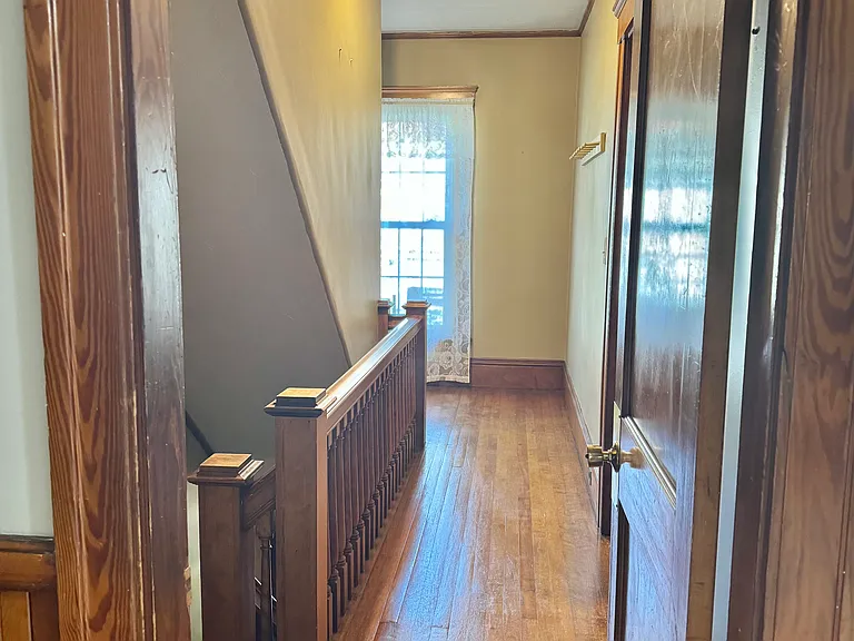 This 2nd floor hallway leads you to the stairs to the front exterior door.