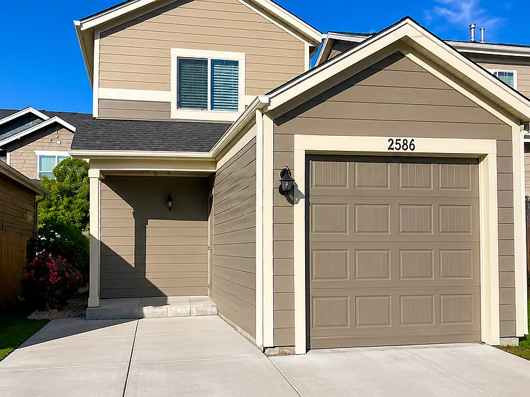 Off alley attached single car garage and parking space