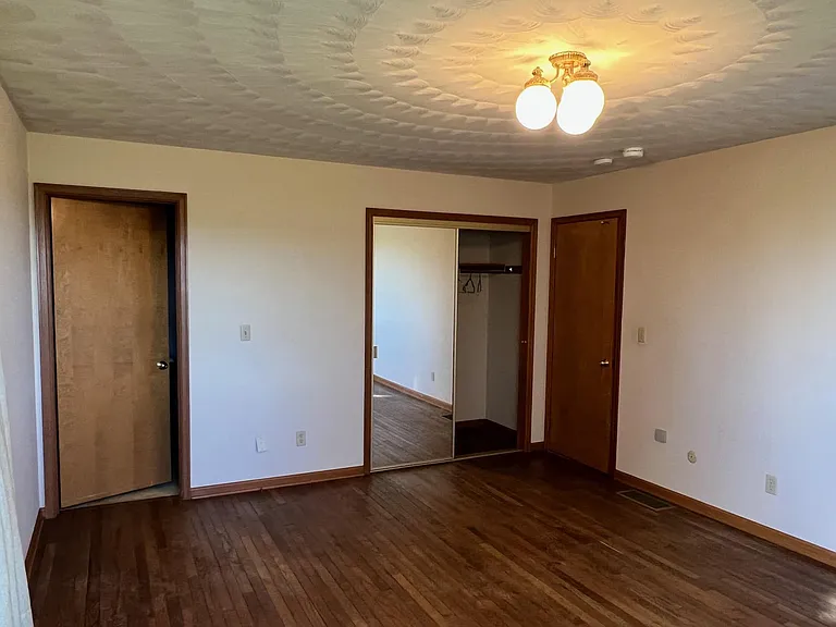 Master Bedroom
Very large mirrored closet, bigger than some walk-ins
door on left to master 1/2 bath