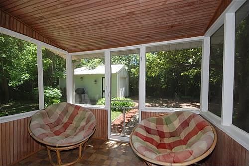 The screened porch is great for entertaining.