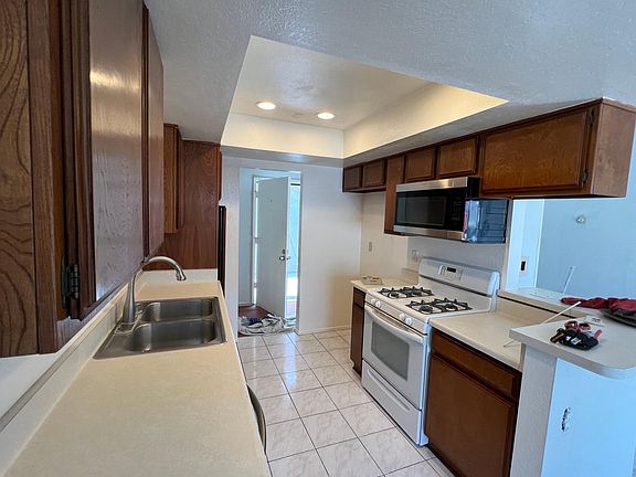 Kitchen showing entry door in background