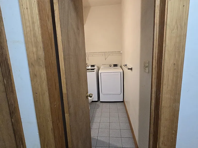 Laundry room with sink and toilet