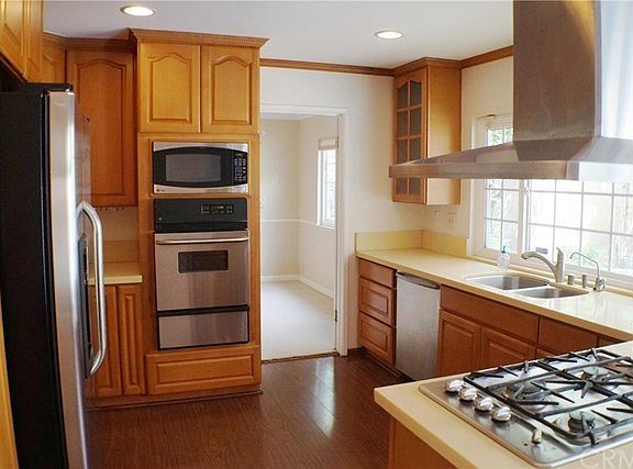 Remodeled KITCHEN- top-of-line stainless steel appliances, quartz contertops, and recessed lights. Refrigerator can be included in sale (w/o Seller's warranty).