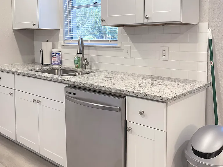 Dishwasher, Sink and Abundant Cupboards
