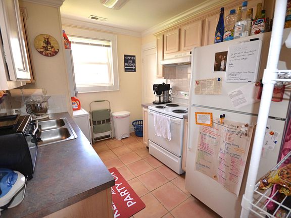Kitchen with stack washer/dryer and backdoor
