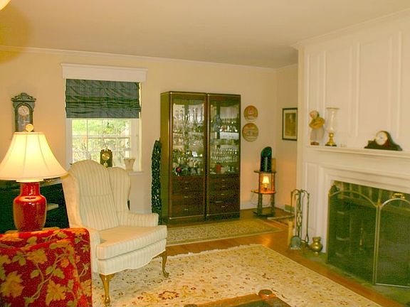 Beautiful Living room with fireplace, French door to screened porch