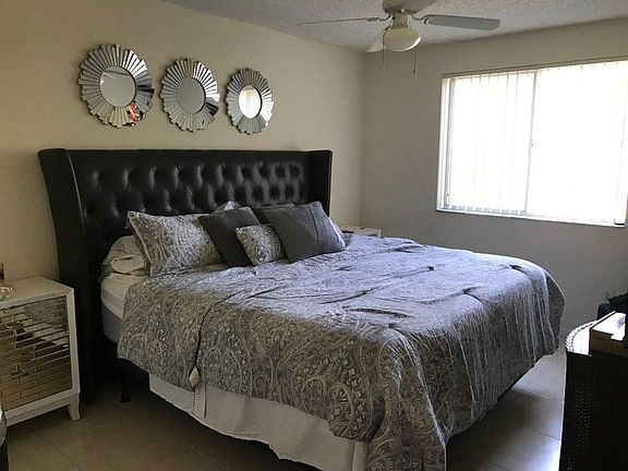 Bedroom 11'' wide x 14'' Long (pics of previous tenants furniture). Includes a Large Walk in Closet 6'' w x 6'' L and additional 2nd Closet 
3'' w x 5 '' L. Also , a large vanity/sink 4'' w x 5'' L and ceiling fan .