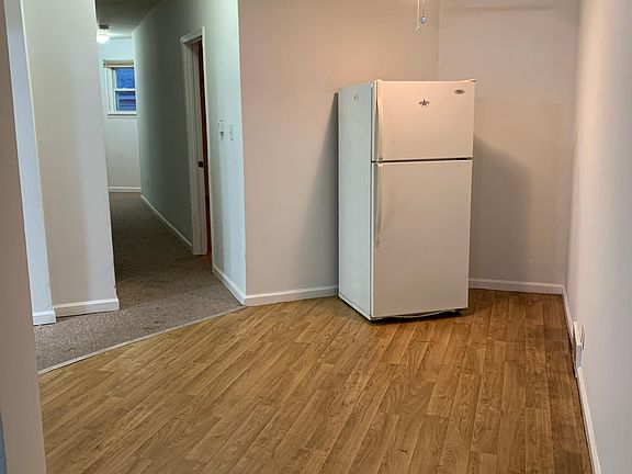 Breakfast nook in kitchen w refrigerator