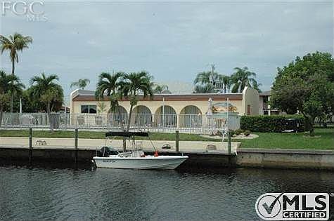 Rear of Condo Complex looking at boat dock and community pool