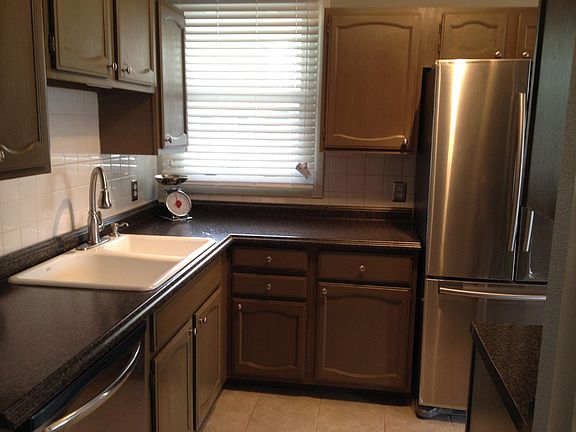 Pull out sprayer faucet, some roll out shelves in cabinets, built in-pull out solid wood cutting board