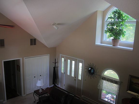 View to great room from loft area, lots of natural light