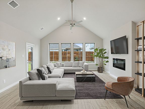 Living Room in the Claret home plan by Trophy Signature Homes - REPRESENTATIVE PHOTO