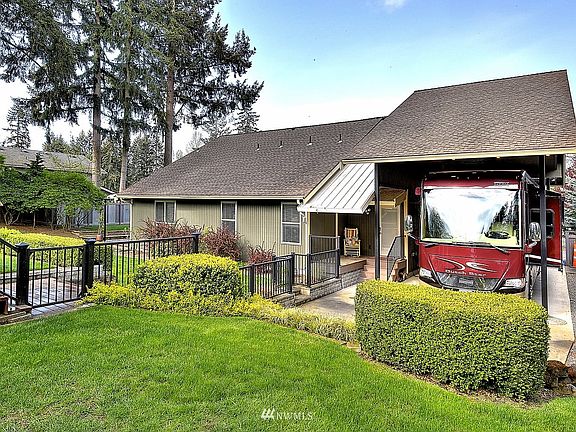 Back view of home. Separated gated yard for the safety of family pets and children/grandchildren.