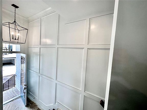 Chaucer - Main Level Entry show casing Split Level Staircase Custom Trim Accent Wall Photos sho