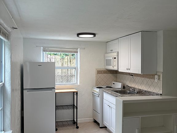 Kitchen area - new refrigerator and cabinets
